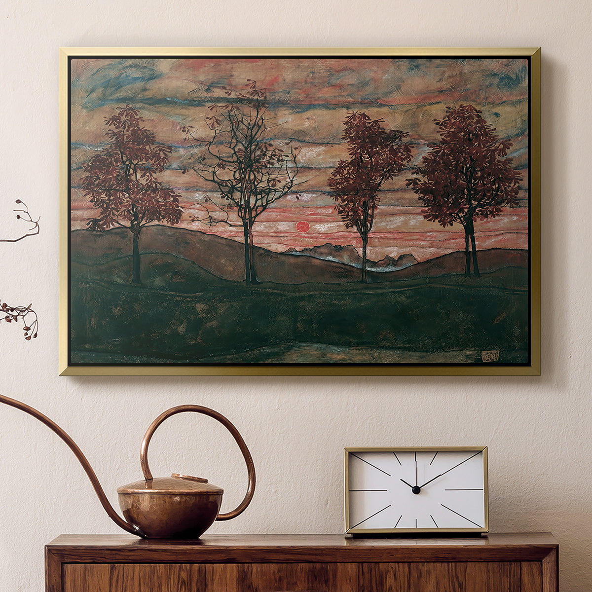Gold floater framed canvas featuring a stylized nature scene with strong outlines and simple composition, displayed above a cabinet in a soft-toned living room.