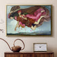 Gold floater framed canvas featuring a dreamlike scene with draped figures drifting across dark background, displayed above a cabinet in a soft-toned living room.