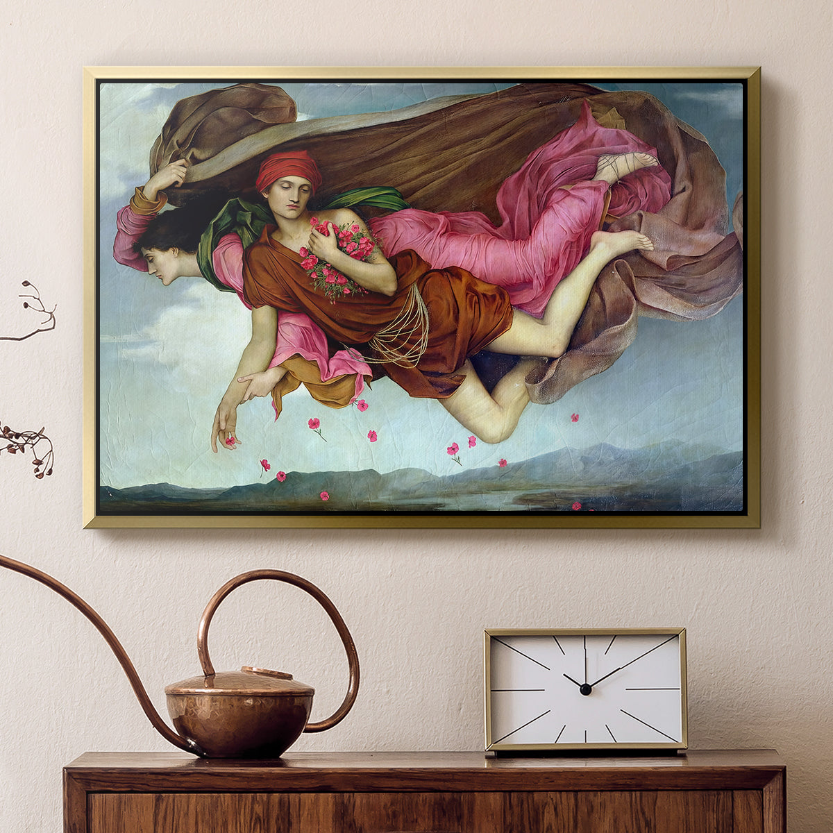 Gold floater framed canvas featuring a dreamlike scene with draped figures drifting across dark background, displayed above a cabinet in a soft-toned living room.