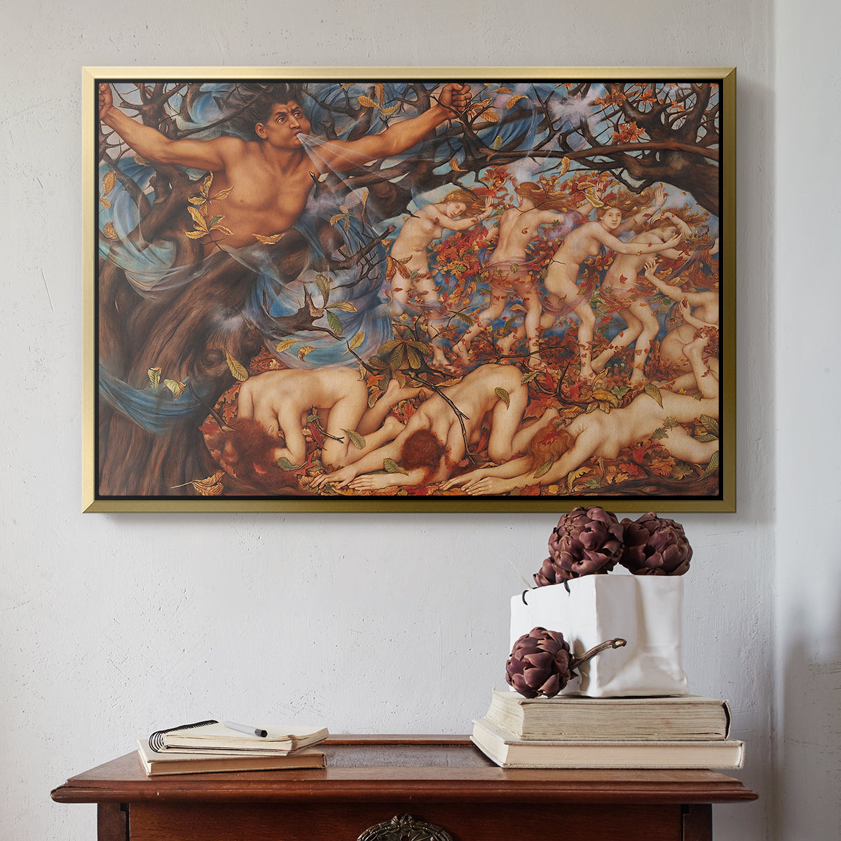 Gold floater framed canvas featuring Boreas and the Fallen Leaves, c. 1910-1914 by Evelyn De Morgan above an entryway table in a minimalist foyer.