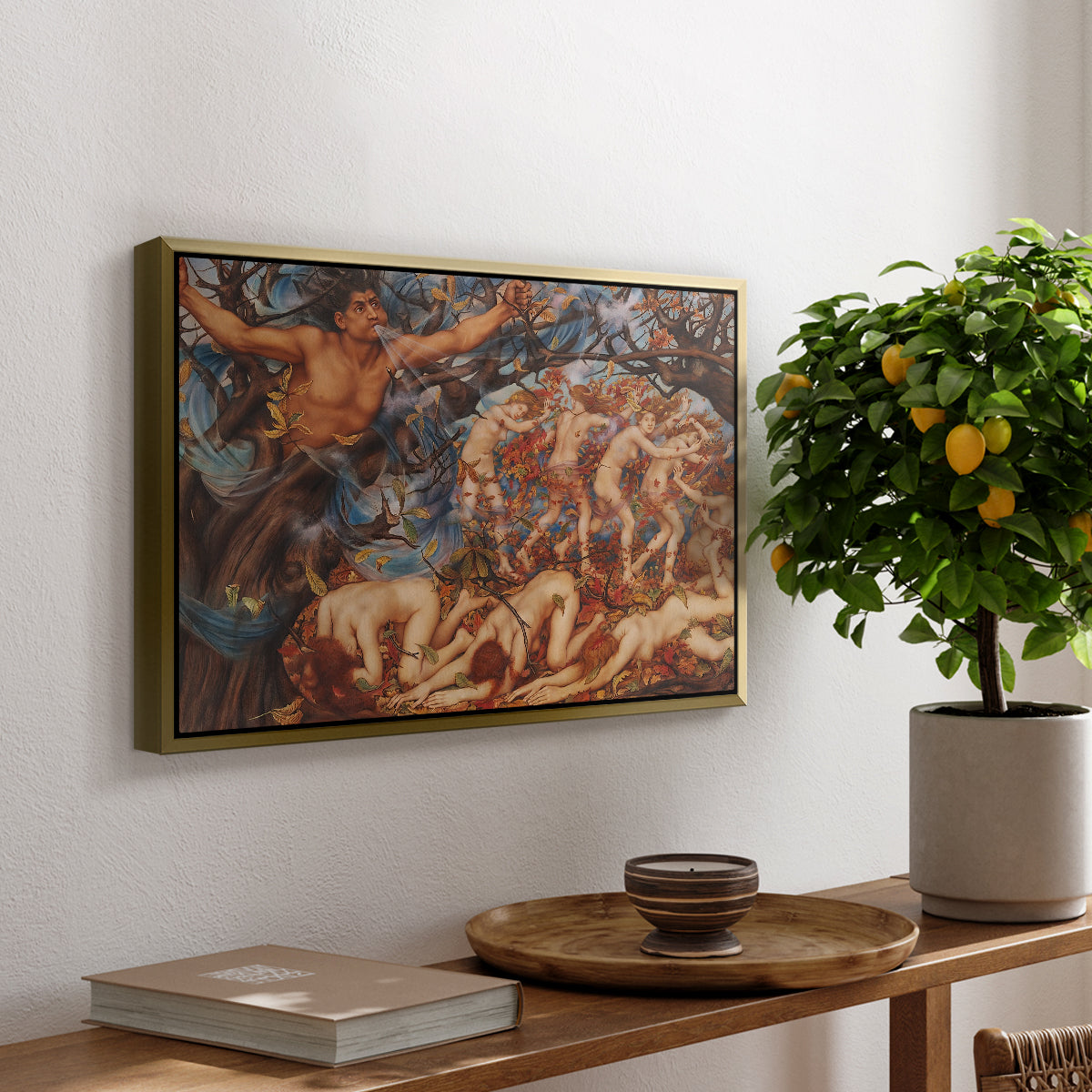 Boreas and the Fallen Leaves, c. 1910-1914 by Evelyn De Morgan, presented in a gold floater framed canvas featuring swirling figures carried by wind among falling leaves in dynamic composition, displayed above a hallway console table.