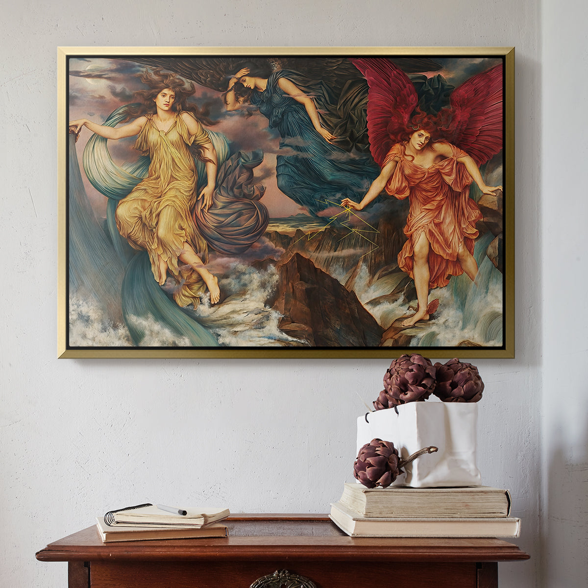 Gold floater framed canvas featuring The Storm Spirits, 1900 by Evelyn De Morgan above an entryway table in a minimalist foyer.