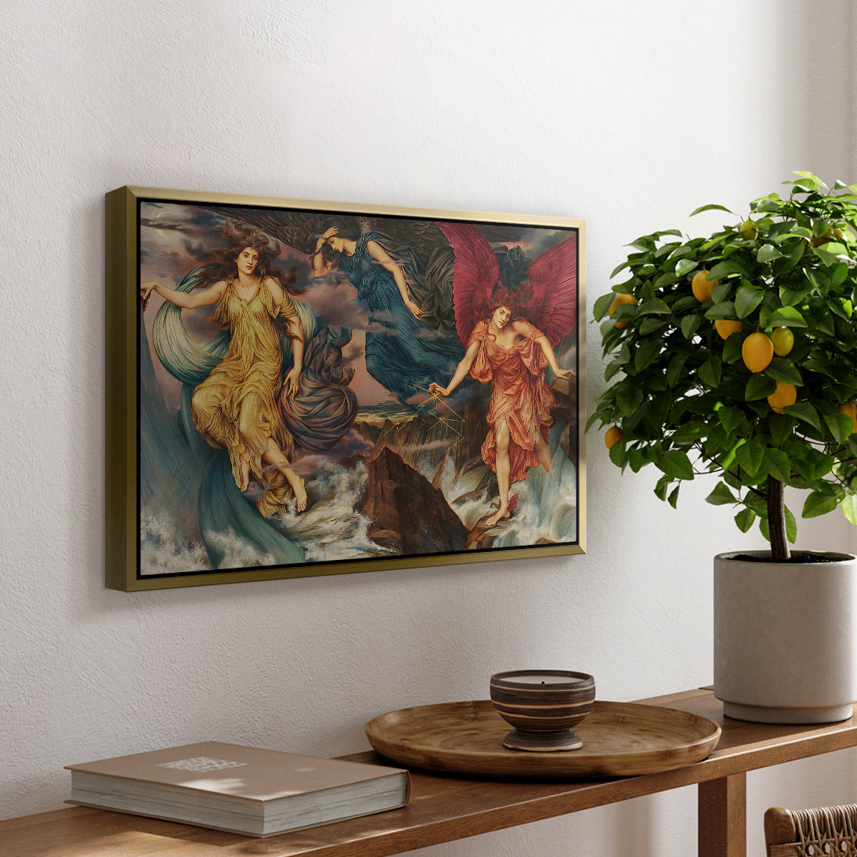 The Storm Spirits, 1900 by Evelyn De Morgan, presented in a gold floater framed canvas featuring multiple figures swirling through sky representing storm forces in motion, displayed above a hallway console table.