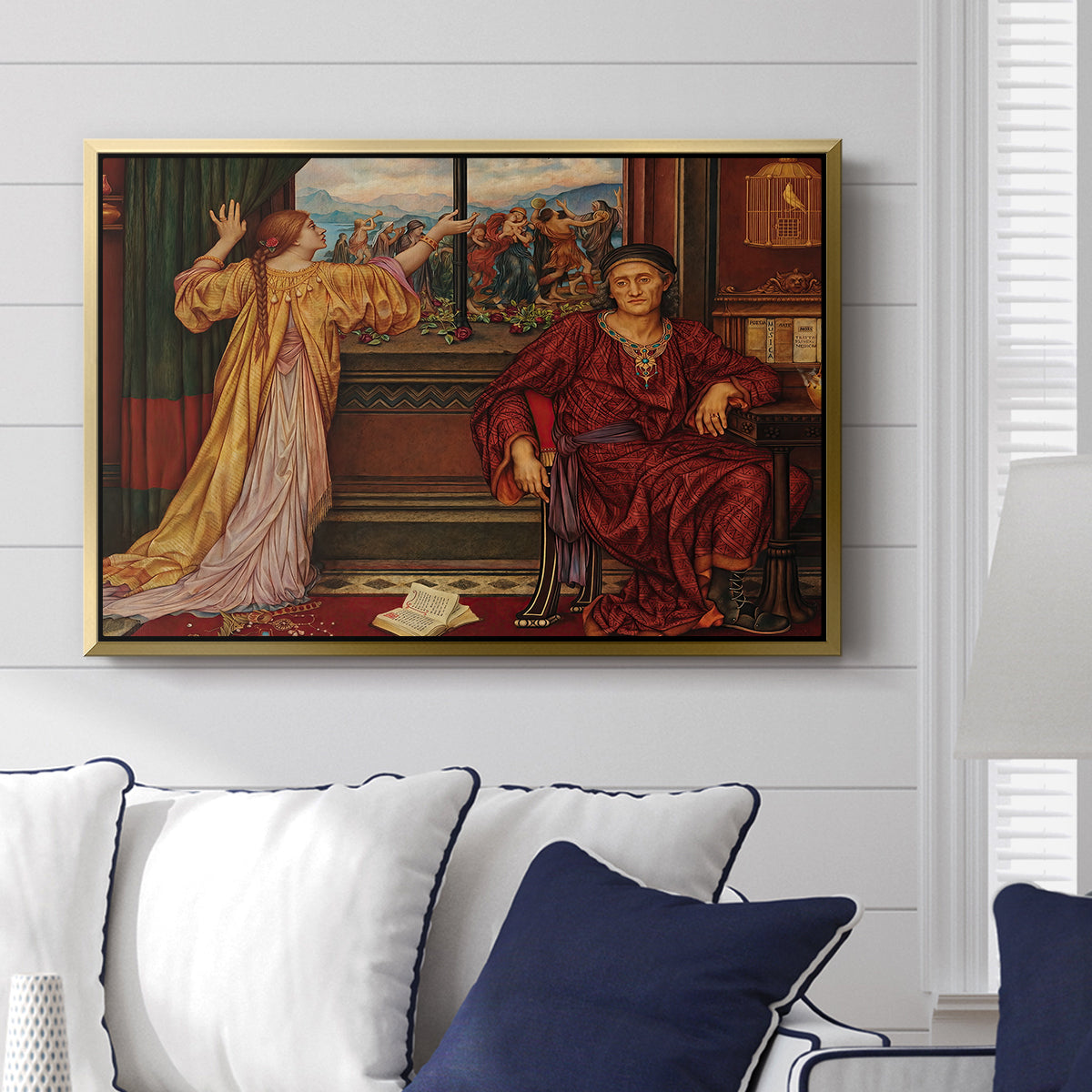 The Gilded Cage, c. 1901-1902 by Evelyn De Morgan displayed above a sofa in a living room in a gold floater frame, featuring a symbolic scene of figure enclosed within decorative surroundings.
