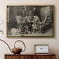 Gold floater framed canvas featuring an intimate interior with players focused on board and pieces, displayed above a cabinet in a soft-toned living room.