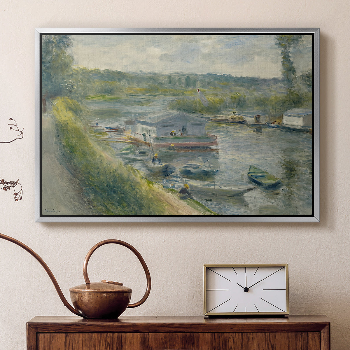 Silver floater framed canvas featuring an impressionist depiction of working boat along calm waterway, displayed above a cabinet in a soft-toned living room.