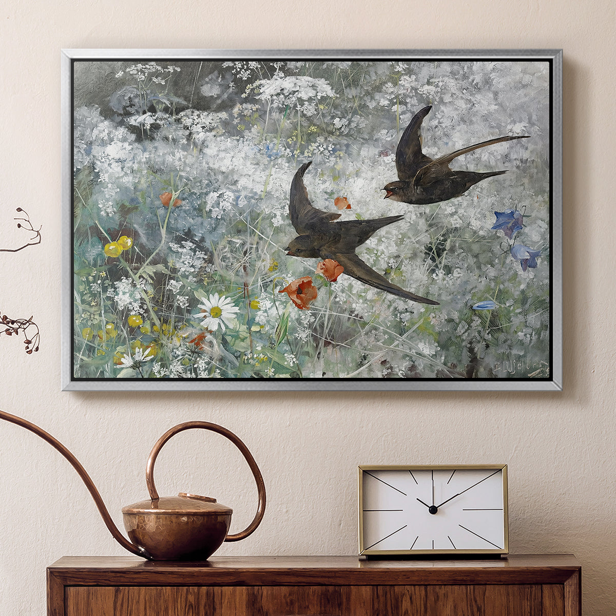 Silver floater framed canvas featuring a multiple birds flying together in natural outdoor scene, displayed above a cabinet in a soft-toned living room.