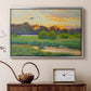 Silver floater framed canvas featuring a wild duck gliding through a golden sunset sky, displayed above a cabinet in a soft-toned living room.