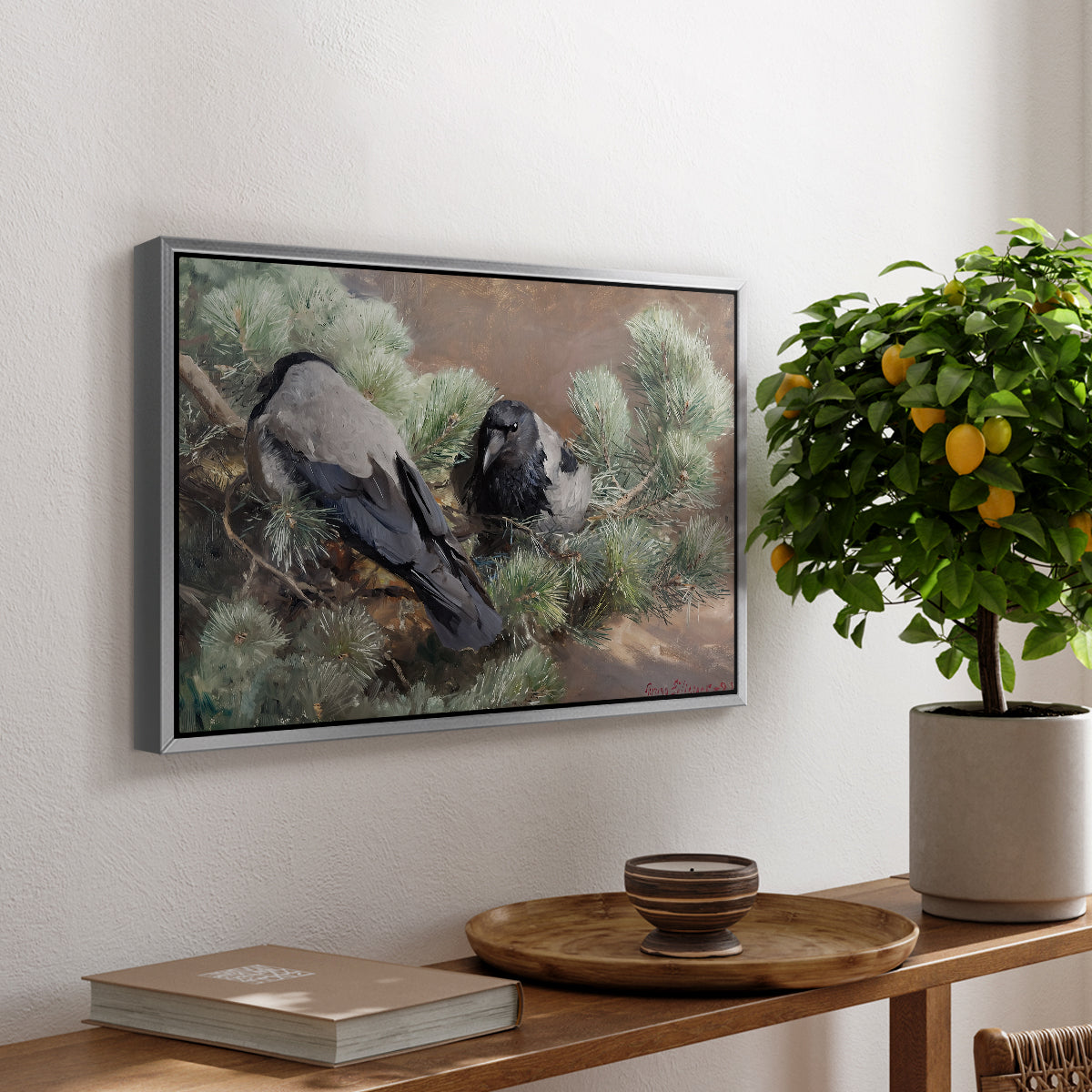 Hooded Crows (Kråkor), 1891 by Bruno Liljefors, presented in a silver floater framed canvas featuring two crows perched on ground among grass and earth tones, displayed above a hallway console table.