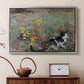Silver floater framed canvas featuring an animal scene of cat hidden in lush meadow vegetation, displayed above a cabinet in a soft-toned living room.