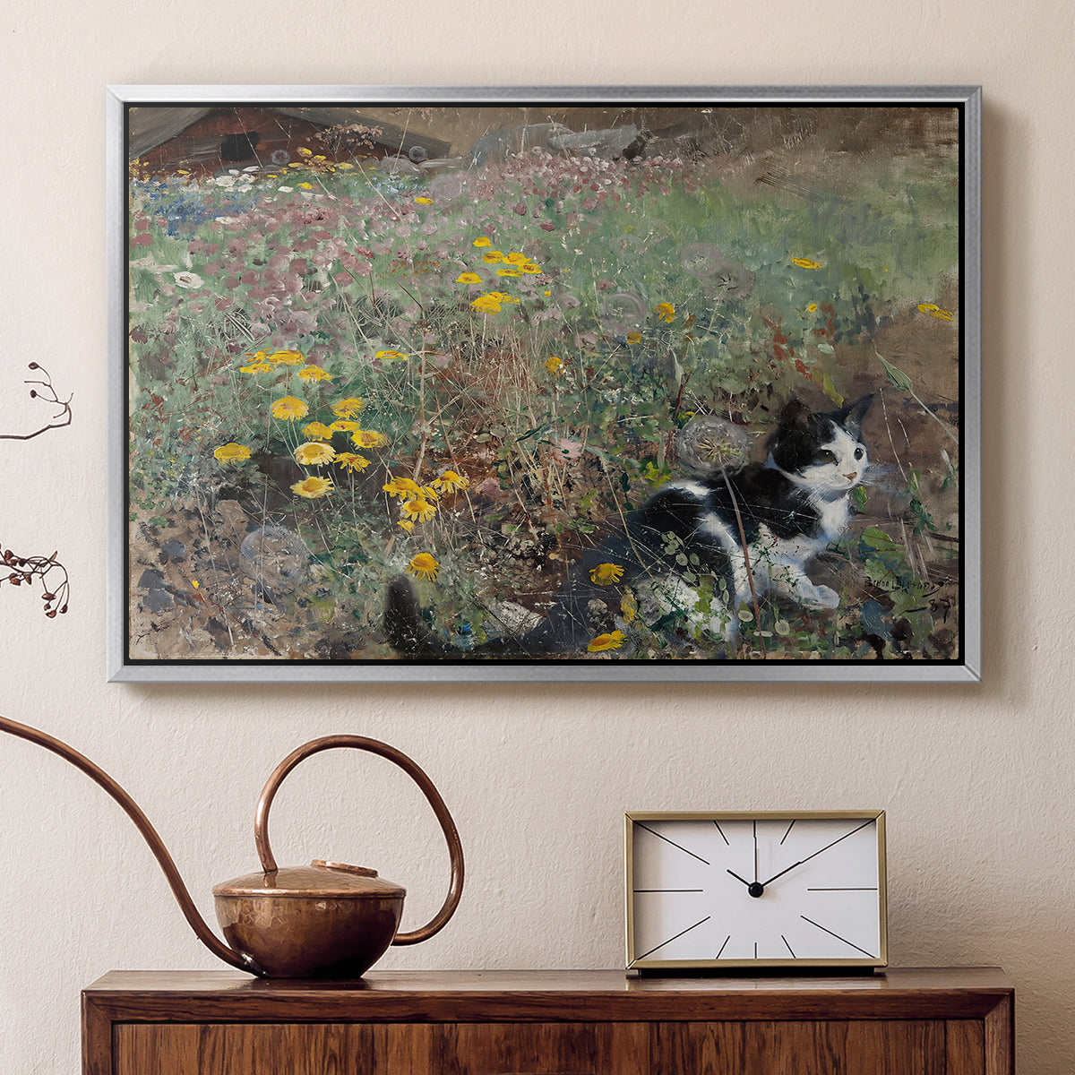 Silver floater framed canvas featuring an animal scene of cat hidden in lush meadow vegetation, displayed above a cabinet in a soft-toned living room.
