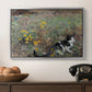 Cat on a Flowery Meadow, 1887 by Bruno Liljefors in a silver floater framed canvas displayed above a console table in a hallway, featuring a naturalistic depiction of cat in blooming countryside setting.