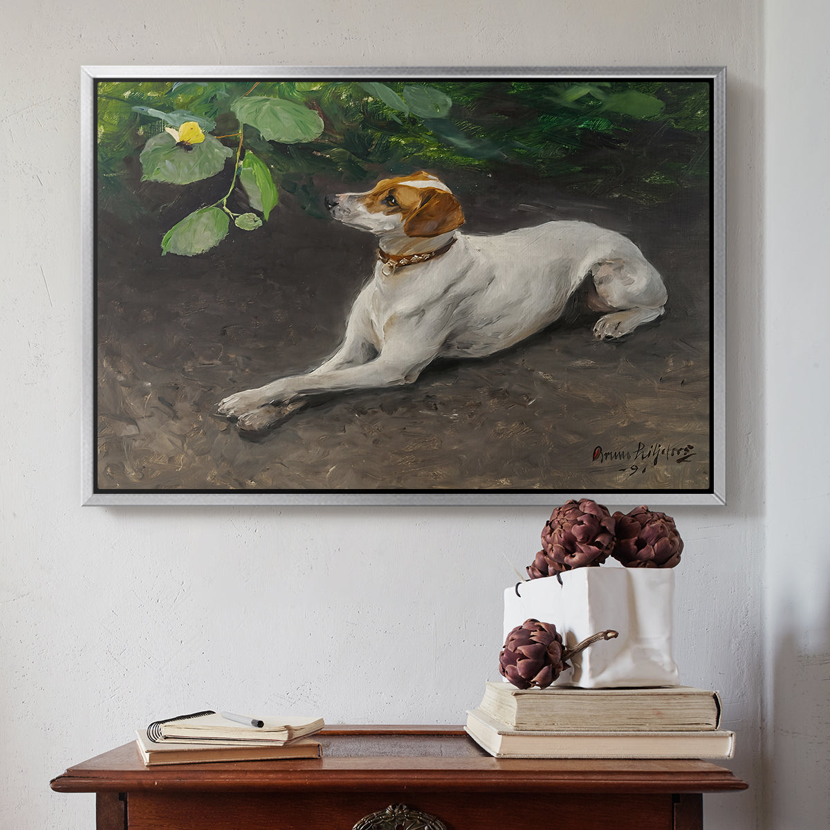 Silver floater framed canvas featuring Portrait of a Dog, 1891 by Bruno Liljefors above an entryway table in a minimalist foyer.