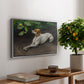 Portrait of a Dog, 1891 by Bruno Liljefors, presented in a silver floater framed canvas featuring a dog lying on ground with head raised in natural outdoor setting, displayed above a hallway console table.
