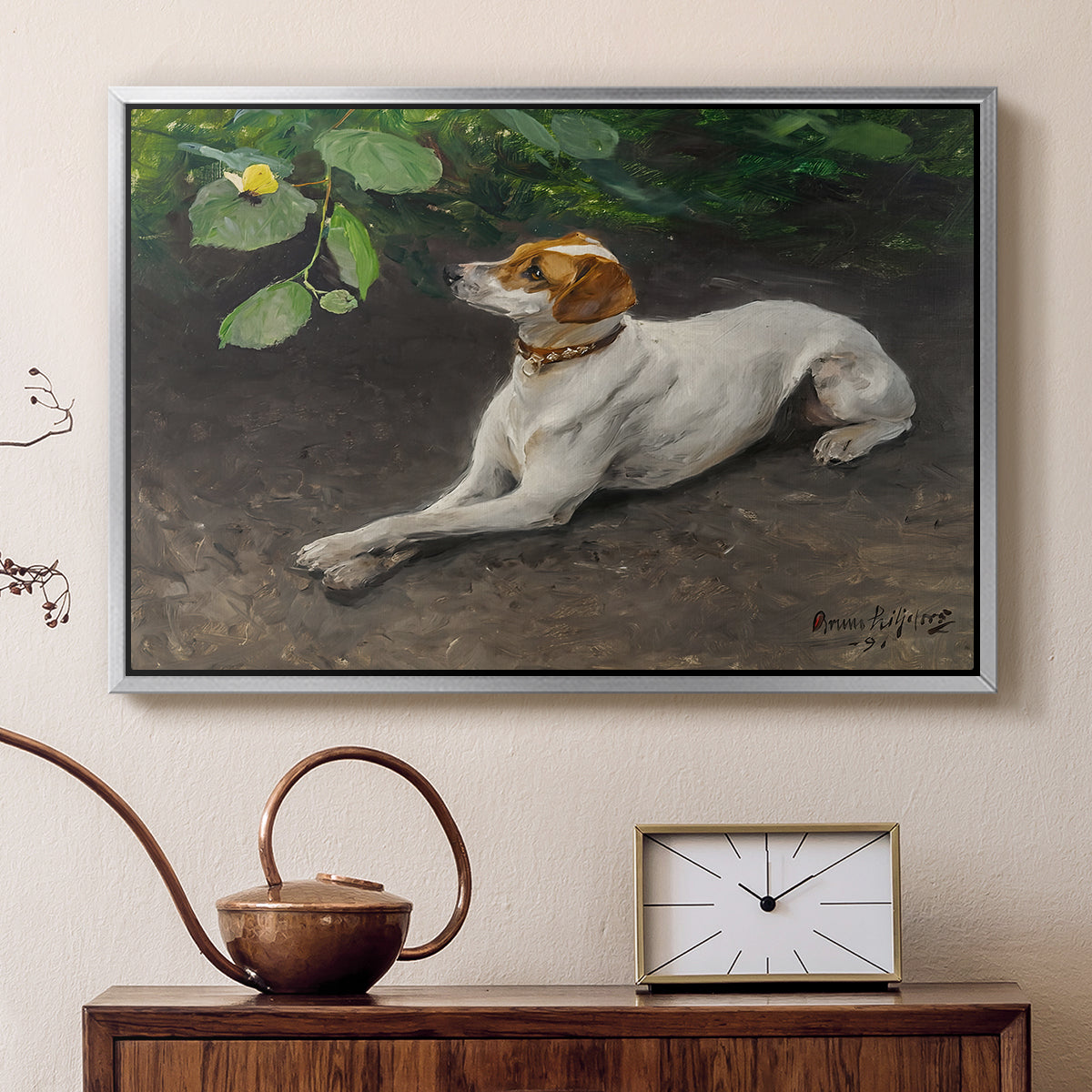 Silver floater framed canvas featuring an animal painting of dog stretched out on earthy terrain, displayed above a cabinet in a soft-toned living room.