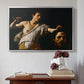 Silver floater framed canvas featuring David with the Head of Goliath (Vienna Version), c. 1607 by Caravaggio above an entryway table in a minimalist foyer.