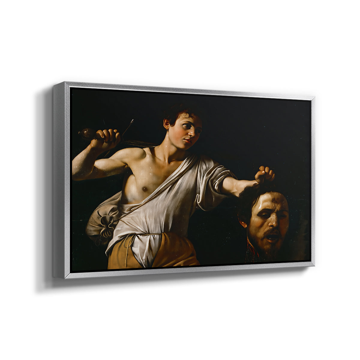 Angled view of David with the Head of Goliath (Vienna Version), c. 1607 by Caravaggio in a silver floater framed canvas.
