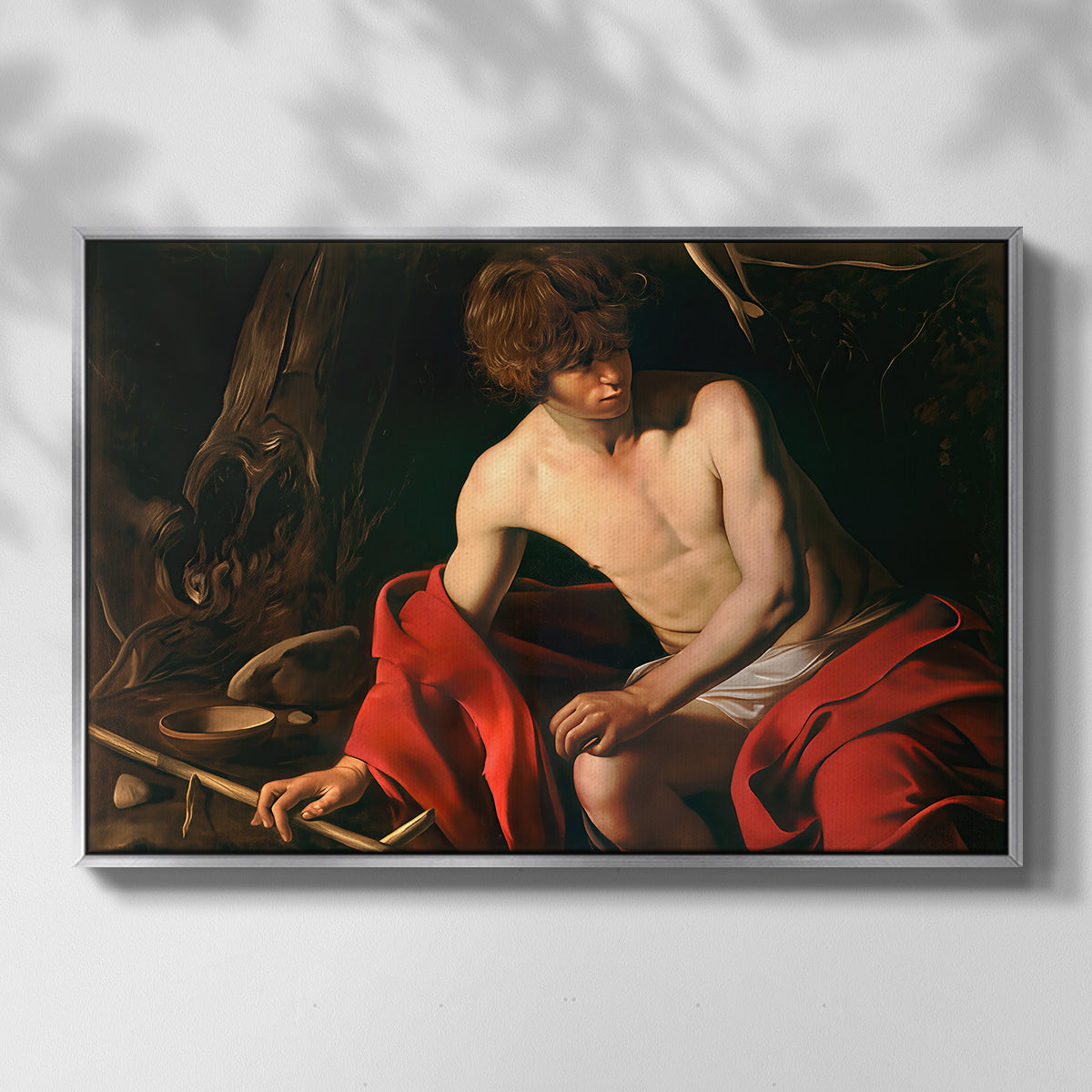 Front view of Saint John the Baptist in the Wilderness, c. 1603-1604 by Caravaggio in a silver floater framed canvas.