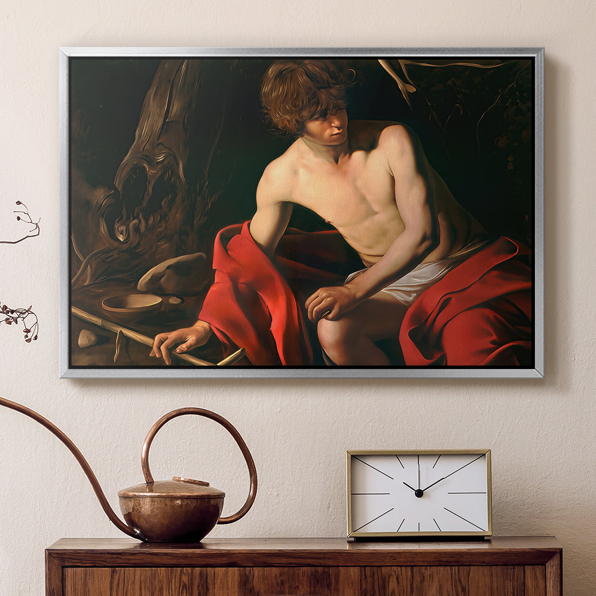 Silver floater framed canvas featuring a biblical youth seated outdoors with symbolic staff and minimal landscape, displayed above a cabinet in a soft-toned living room.