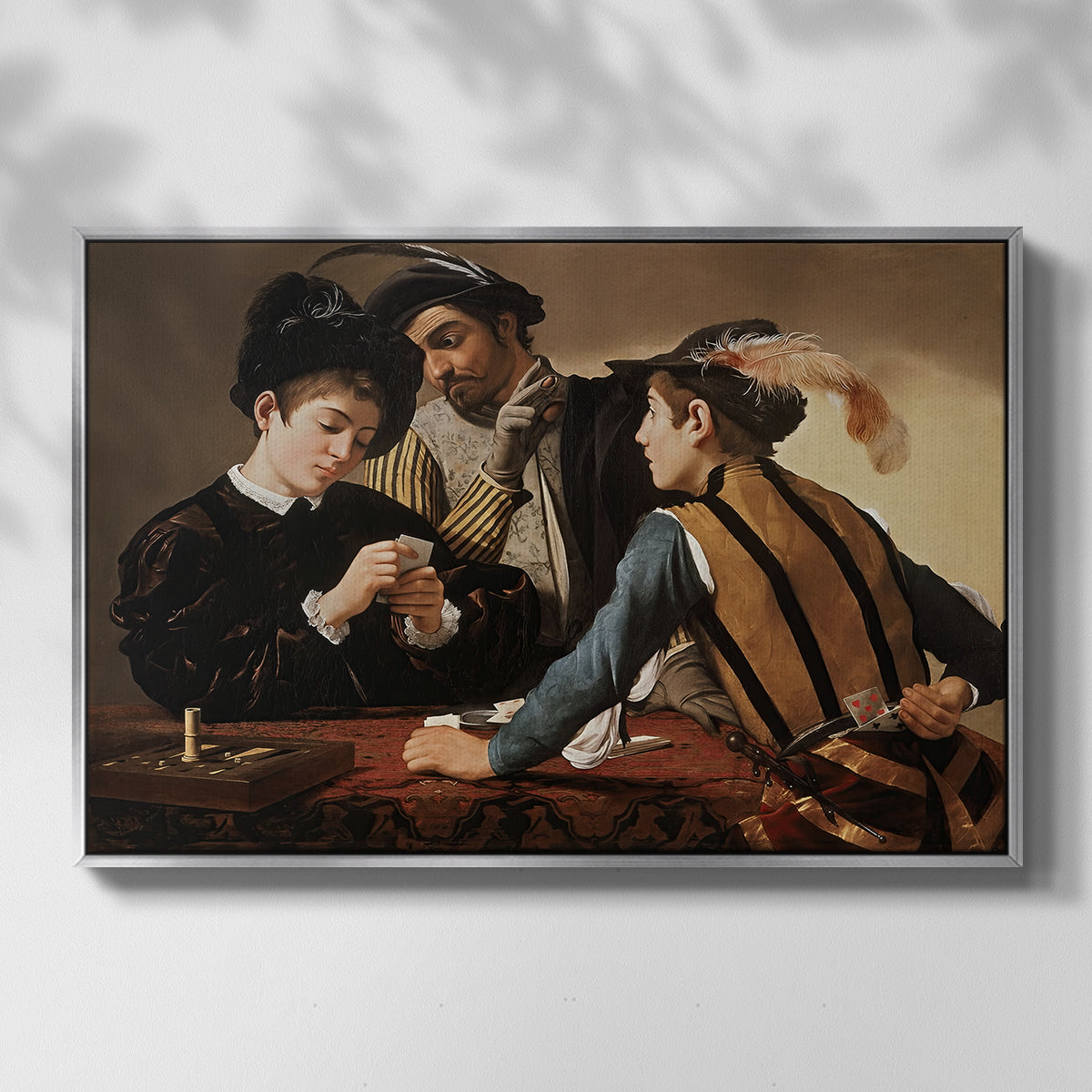 Front view of The Cardsharps, c. 1594 by Caravaggio in a silver floater framed canvas.