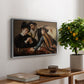The Cardsharps, c. 1594 by Caravaggio, presented in a silver floater framed canvas featuring two men cheating at cards while a third figure secretly observes behind them, displayed above a hallway console table.