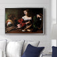 Martha and Mary Magdalene, c. 1598 by Caravaggio displayed above a sofa in a living room in a silver floater frame, featuring a biblical scene of Martha speaking to Mary Magdalene indoors.