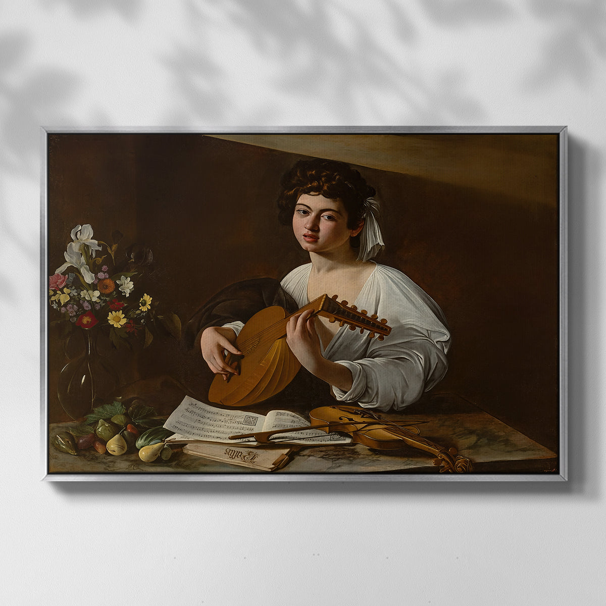 Front view of The Lute Player (Hermitage Version), c. 1596 by Caravaggio in a silver floater framed canvas.