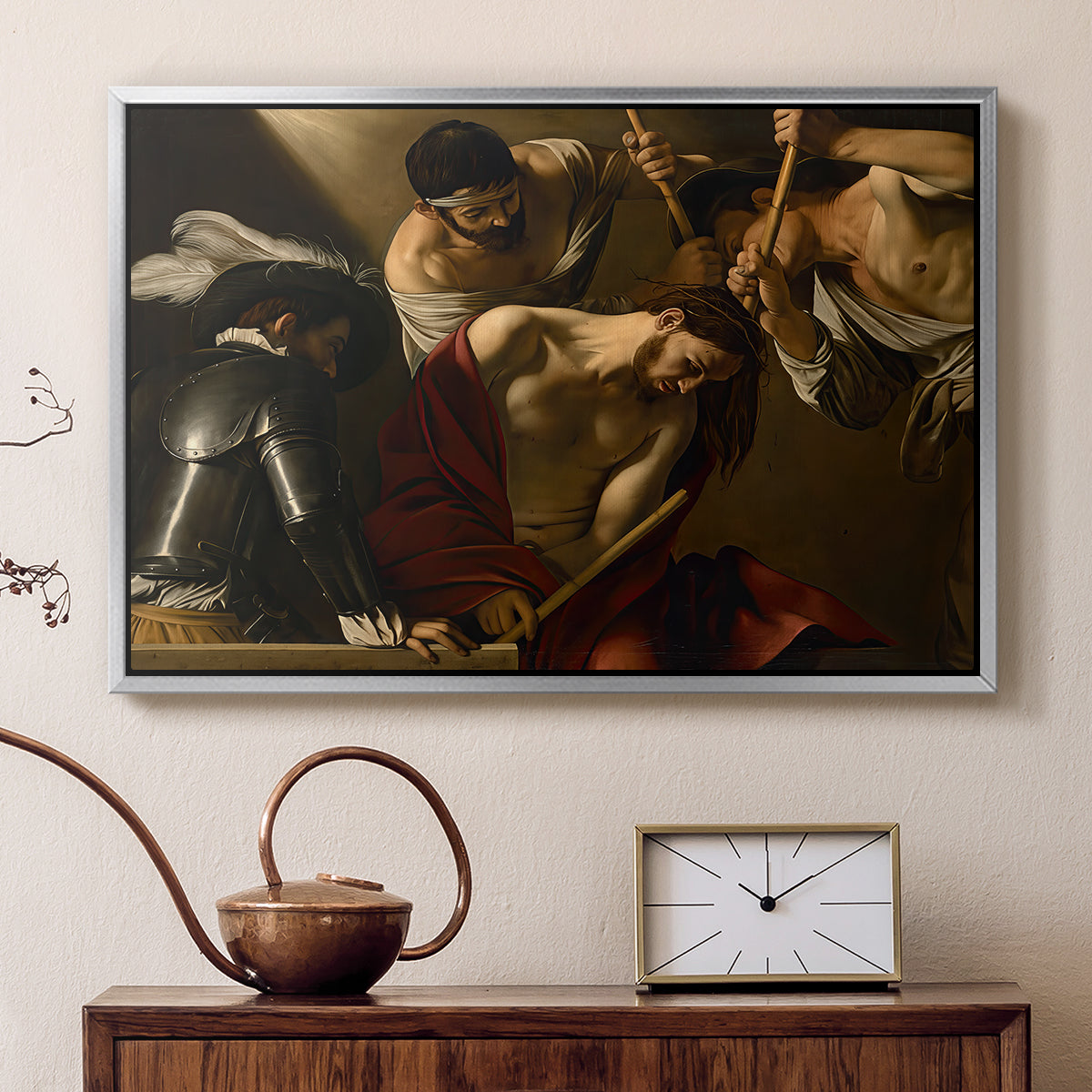 Silver floater framed canvas featuring a dramatic depiction of figures forcing thorn crown onto Christ, displayed above a cabinet in a soft-toned living room.