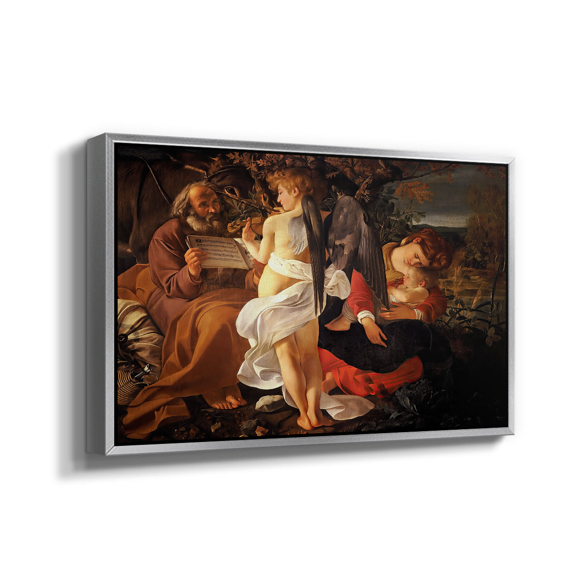 Angled view of Rest on the Flight into Egypt, c. 1597 by Caravaggio in a silver floater framed canvas.