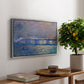 Charing Cross Bridge, 1903 by Claude Monet, presented in a silver floater framed canvas featuring an impressionist view of bridge stretching across river with soft light and haze, displayed above a hallway console table.