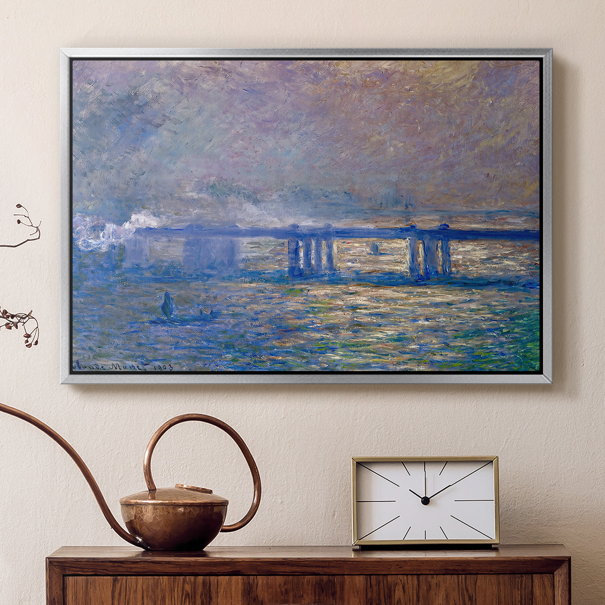 Silver floater framed canvas featuring an atmospheric depiction of London bridge with reflections in water, displayed above a cabinet in a soft-toned living room.