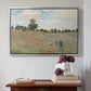 Silver floater framed canvas featuring The Poppy Field near Argenteuil, 1873 by Claude Monet above an entryway table in a minimalist foyer.