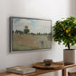 The Poppy Field near Argenteuil, 1873 by Claude Monet, presented in a silver floater framed canvas featuring a field of red poppies with figures walking across rolling landscape, displayed above a hallway console table.