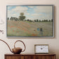 Silver floater framed canvas featuring a bright meadow filled with poppies under open sky, displayed above a cabinet in a soft-toned living room.
