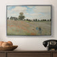 The Poppy Field near Argenteuil, 1873 by Claude Monet in a silver floater framed canvas displayed above a console table in a hallway, featuring a rural landscape with scattered figures among blooming flowers.