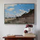 Silver floater framed canvas featuring The Beach at Honfleur, 1864 by Claude Monet above an entryway table in a minimalist foyer.