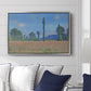 Poppy Field (Giverny), 1890-1891 by Claude Monet displayed above a sofa in a living room in a silver floater frame, featuring an impressionist landscape of blooming poppies in countryside.