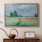 Silver floater framed canvas featuring an agricultural landscape with tall wheat and distant horizon, displayed above a cabinet in a soft-toned living room.