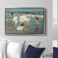 A Holiday, c. 1915 by Edward Henry Potthast displayed above a sofa in a living room in a silver floater frame, featuring a beach scene with figures bathing and standing in waves under bright sky.