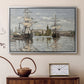 Silver floater framed canvas featuring a harbor view with tall ships lining the waterfront in muted tones, displayed above a cabinet in a soft-toned living room.