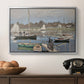The Basin at Argenteuil, 1874 by Claude Monet in a silver floater framed canvas displayed above a console table in a hallway, featuring a tranquil river setting with sailboats and shoreline.