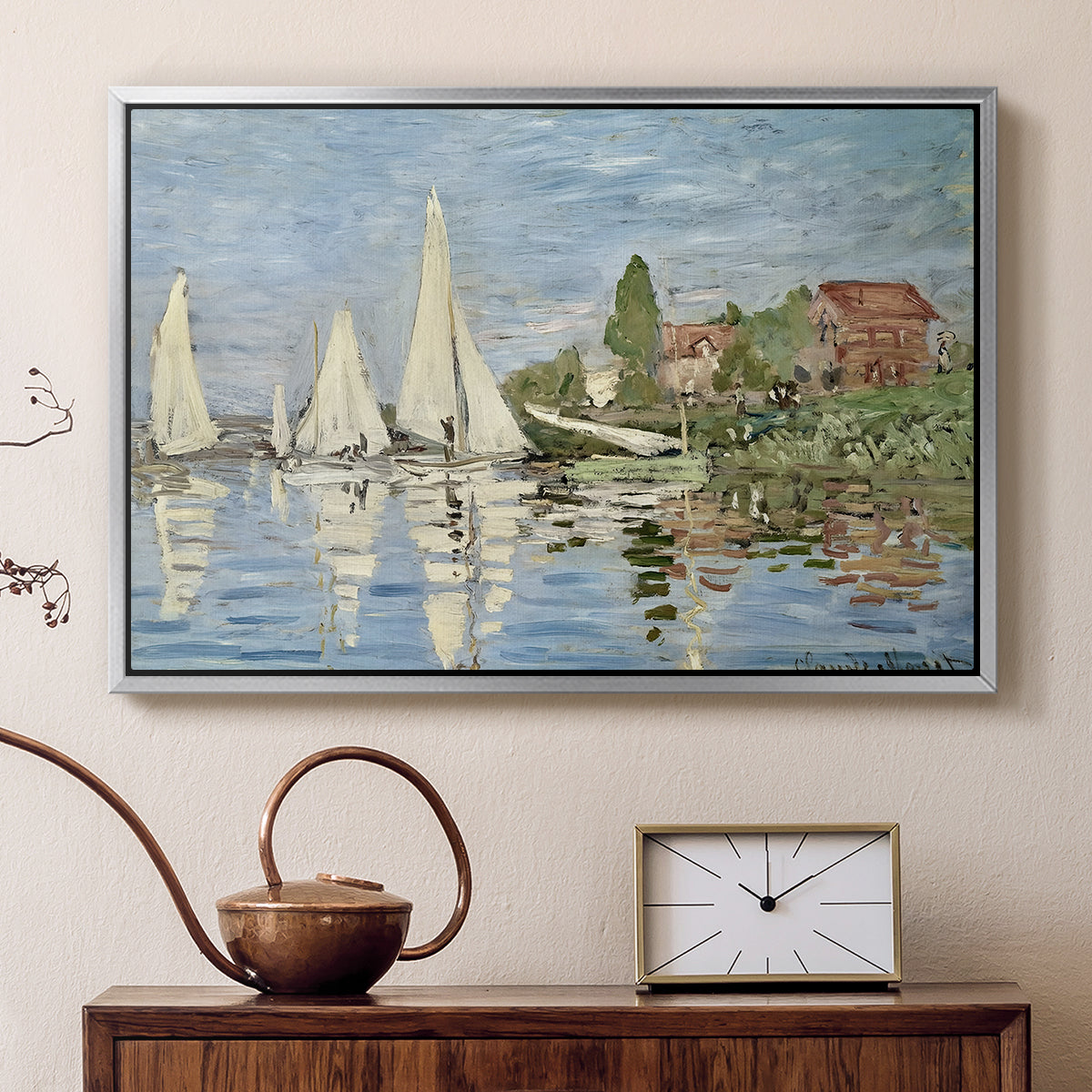 Silver floater framed canvas featuring an impressionist depiction of sailing competition on water, displayed above a cabinet in a soft-toned living room.