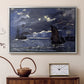 Silver floater framed canvas featuring a dramatic ocean scene with light reflecting across water at night, displayed above a cabinet in a soft-toned living room.