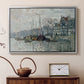 Silver floater framed canvas featuring an urban waterway with docked boats and European buildings, displayed above a cabinet in a soft-toned living room.