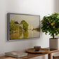 Houses on the Achterzaan, 1871 by Claude Monet, presented in a silver floater framed canvas featuring colorful houses reflected in calm river surrounded by greenery, displayed above a hallway console table.