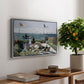 Garden at Sainte-Adresse, 1867 by Claude Monet, presented in a silver floater framed canvas featuring a seaside garden with flowers, flags, and figures overlooking the water, displayed above a hallway console table.