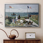 Silver floater framed canvas featuring a vibrant garden scene with colorful blooms and distant sea, displayed above a cabinet in a soft-toned living room.