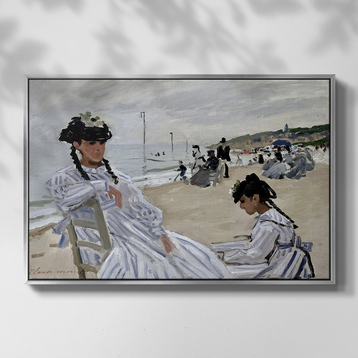 Front view of On the Beach at Trouville, 1870 by Claude Monet in a silver floater framed canvas.