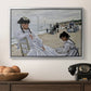 On the Beach at Trouville, 1870 by Claude Monet in a silver floater framed canvas displayed above a console table in a hallway, featuring a coastal leisure scene with figures looking out to sea.