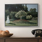 Woman in the Garden, Sainte-Adresse, 1867 by Claude Monet in a silver floater framed canvas displayed above a console table in a hallway, featuring a tranquil garden portrait with soft natural light.